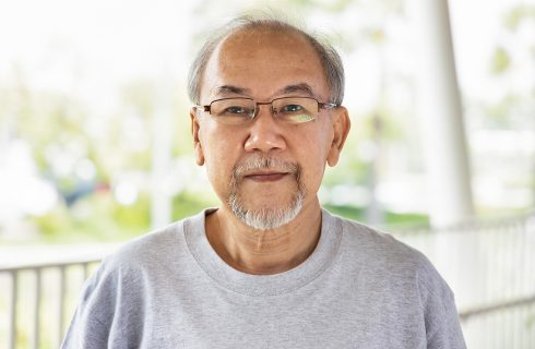 Portrait of old asian man with grey hair and beard